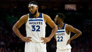 PHILADELPHIA, PA - OCTOBER 30: Karl-Anthony Towns #32 and Andrew Wiggins #22 of the Minnesota Timberwolves look on against the Philadelphia 76ers at the Wells Fargo Center on October 30, 2019 in Philadelphia, Pennsylvania. NOTE TO USER: User expressly acknowledges and agrees that, by downloading and or using this photograph, User is consenting to the terms and conditions of the Getty Images License Agreement. (Photo by Mitchell Leff/Getty Images)