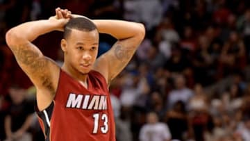 Nov 25, 2014; Miami, FL, USA; Miami Heat guard Shabazz Napier (13) reacts during the second half against the Golden State Warriors at American Airlines Arena. the Warriors won 114-97. Mandatory Credit: Steve Mitchell-USA TODAY Sports
