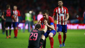 MADRID, SPAIN - MAY 03: Granit Xhaka is dejected and consoled by Gabi of Atletico Madrid after the UEFA Europa League Semi Final second leg match between Atletico Madrid and Arsenal FC at Estadio Wanda Metropolitano on May 3, 2018 in Madrid, Spain. (Photo by Gonzalo Arroyo Moreno/Getty Images)