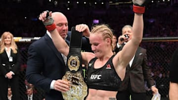 TORONTO, CANADA - DECEMBER 08: (L-R) UFC president Dana White presents Valentina Shevchenko of Kyrgyzstan her championship belt after her victory over Joanna Jedrzejczyk of Poland in their UFC strawweight championship fight during the UFC 231 event at Scotiabank Arena on December 8, 2018 in Toronto, Canada. (Photo by Josh Hedges/Zuffa LLC/Zuffa LLC via Getty Images)