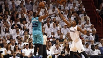 Apr 20, 2016; Miami, FL, USA; Charlotte Hornets center Al Jefferson (25) shoots the ball over Miami Heat center Hassan Whiteside (21) in game two of the first round of the NBA Playoffs during the second quarter at American Airlines Arena. Mandatory Credit: Steve Mitchell-USA TODAY Sports