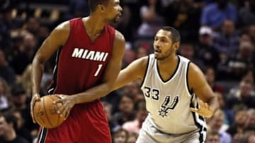 Feb 6, 2015; San Antonio, TX, USA; Miami Heat center Chris Bosh (1) looks to pass as San Antonio Spurs power forward Boris Diaw (33) defends during the first half at AT&T Center. Mandatory Credit: Soobum Im-USA TODAY Sports
