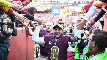 Nov 13, 2016; Landover, MD, USA; Washington Redskins quarterback Kirk Cousins (8) is congratulated by fans after the game against the Minnesota Vikings at FedEx Field. The Washington Redskins won 26 - 20. Mandatory Credit: Brad Mills-USA TODAY Sports