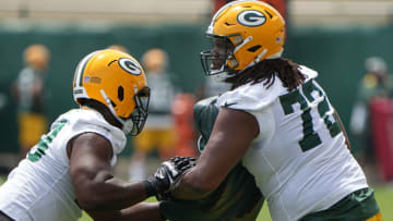 May 31, 2022; Green Bay, WI, USA; Green Bay Packers player Caleb Jones (72) works with Yosh Nijman (73) during organized team activities (OTA) Tuesday, May 31, 2022 in Green Bay, Wis. Mandatory Credit: Mark Hoffman-USA TODAY Sports