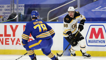 Apr 20, 2021; Buffalo, New York, USA; Boston Bruins right wing David Pastrnak (88) looks to make a pass as Buffalo Sabres defenseman Jacob Bryson (78) defends during the third period at KeyBank Center. Mandatory Credit: Timothy T. Ludwig-USA TODAY Sports