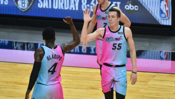 Duncan Robinson #55 of the Miami Heat celebrates his three point basket with Victor Oladipo #4(Photo by Eric Espada/Getty Images)