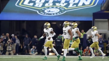 ARLINGTON, TEXAS - DECEMBER 29: Asmar Bilal #22 of the Notre Dame Fighting Irish runs to the sideline with teammates after a play in the first half against the Clemson Tigers during the College Football Playoff Semifinal Goodyear Cotton Bowl Classic at AT&T Stadium on December 29, 2018 in Arlington, Texas. (Photo by Tim Warner/Getty Images)
