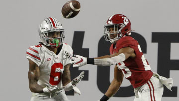MIAMI GARDENS, FLORIDA - JANUARY 11: Jameson Williams #6 of the Ohio State Buckeyes attempts a reception against Josh Jobe #28 of thee Alabama Crimson Tide during the CFP National Championship Presented by AT&T at Hard Rock Stadium on January 11, 2021 in Miami Gardens, Florida. (Photo by Sam Greenwood/Getty Images)