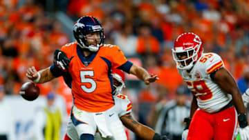 DENVER, CO - OCTOBER 17: Linebacker Anthony Hitchens #53 of the Kansas City Chiefs strips the ball away from quarterback Joe Flacco #5 of the Denver Broncos as linebacker Reggie Ragland #59 runs to recover the ball during the second quarter at Empower Field at Mile High on October 17, 2019 in Denver, Colorado. (Photo by Justin Edmonds/Getty Images)