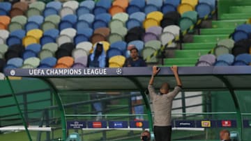 LISBON, PORTUGAL - AUGUST 15: A dejected Pep Guardiola the head coach / manager of Manchester City reacts during the UEFA Champions League Quarter Final match between Manchester City and Lyon at Estadio Jose Alvalade on August 15, 2020 in Lisbon, Portugal. (Photo by Matthew Ashton - AMA/Getty Images)