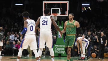 BOSTON, MA - DECEMBER 12: Joel Embiid #21 of the Philadelphia 76ers high-fives Jayson Tatum #0 of the Boston Celtics after the game on December 12, 2019 at the TD Garden in Boston, Massachusetts. (Photo by Brian Babineau/NBAE via Getty Images)