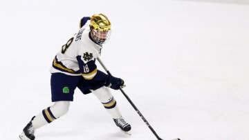 BRIDGEPORT, CT - MARCH 24: Notre Dame Fighting Irish forward Jake Evans (18) with the puck during a NCAA hockey game between Providence Friars and Notre Dame Fighting Irish on March 24, 2018, at Webster Bank Arena in Bridgeport, CT. Notre Dame won 2-1 and moves on to the Frozen Four. (Photo by M. Anthony Nesmith/Icon Sportswire via Getty Images)