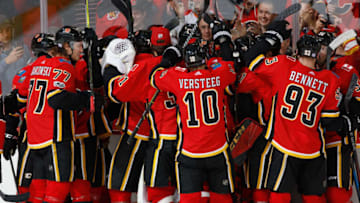 CALGARY, AB - NOVEMBER 2: The Calgary Flames celebrate on ice after an OT win against the Pittsburg Penguins at Scotiabank Saddledome on November 2, 2017 in Calgary, Alberta, Canada. (Photo by Gerry Thomas/NHLI via Getty Images)