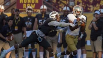 Nov 8, 2014; Tempe, AZ, USA; Notre Dame Fighting Irish wide receiver Chris Brown (2) catches a pass as Arizona State Sun Devils defensive back Lloyd Carrington (8) defends in the fourth quarter at Sun Devil Stadium. Arizona State won 55-31. Mandatory Credit: Matt Cashore-USA TODAY Sports