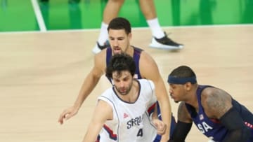 Aug 21, 2016; Rio de Janeiro, Brazil; Serbia point guard Milos Teodosic (4) is geared by United States forward Carmelo Anthony (15) in the men's gold medal basketball game between Serbian and USA during the Rio 2016 Summer Olympic Games at Carioca Arena 1. Mandatory Credit: Jason Getz-USA TODAY Sports