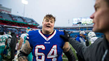 ORCHARD PARK, NY - DECEMBER 17: Richie Incognito #64 of the Buffalo Bills speaks with members of the Miami Dolphins after the game at New Era Field on December 17, 2017 in Orchard Park, New York. Buffalo defeats Miami 24-16. (Photo by Brett Carlsen/Getty Images)