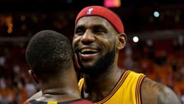 Dec 25, 2014; Miami, FL, USA; Cleveland Cavaliers forward LeBron James (23) hugs Miami Heat guard Dwyane Wade (3) after their game at American Airlines Arena. The Heat won 101-91. Mandatory Credit: Steve Mitchell-USA TODAY Sports