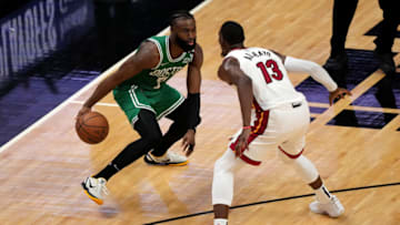 Jaylen Brown #7 of the Boston Celtics dribbles against Bam Adebayo #13 of the Miami Heat(Photo by Eric Espada/Getty Images)