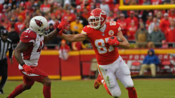 KANSAS CITY, MO - NOVEMBER 11: Tight end Travis Kelce #87 of the Kansas City Chiefs runs up field after catching a pass against pressure from free safety Antoine Bethea #41 of the Arizona Cardinals during the second half on November 11, 2018 at Arrowhead Stadium in Kansas City, Missouri. (Photo by Peter G. Aiken/Getty Images)