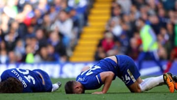 LONDON, ENGLAND - OCTOBER 21: David Luiz of Chelsea and Gary Cahill of Chelsea lie injured during the Premier League match between Chelsea and Watford at Stamford Bridge on October 21, 2017 in London, England. (Photo by Richard Heathcote/Getty Images)