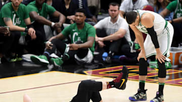 CLEVELAND, OH - MAY 25: Kevin Love of the Cleveland Cavaliers lies on the court as Jayson Tatum of the Boston Celtics reacts after colliding in the first quarter during Game Six of the 2018 NBA Eastern Conference Finals at Quicken Loans Arena on May 25, 2018 in Cleveland, Ohio. NOTE TO USER: User expressly acknowledges and agrees that, by downloading and or using this photograph, User is consenting to the terms and conditions of the Getty Images License Agreement. (Photo by Jason Miller/Getty Images)