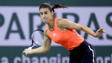INDIAN WELLS, CALIFORNIA - MARCH 14: Sorana Cirstea of Romania returns a shot to Caroline Garcia of France during the BNP Paribas Open at the Indian Wells Tennis Garden on March 14, 2023 in Indian Wells, California. (Photo by Matthew Stockman/Getty Images)