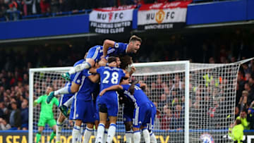 LONDON, ENGLAND - OCTOBER 23: Gary Cahill of Chelsea jumps on tops as N'golo Kante of Chelsea celebrates with his team mates after he scores to make it 4-0 during the Premier League match between Chelsea and Manchester United at Stamford Bridge on October 23, 2016 in London, England. (Photo by Catherine Ivill - AMA/Getty Images)