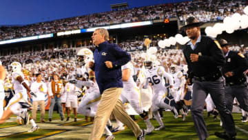ATLANTA, GA - OCTOBER 4: Head Coach Paul Johnson of the Georgia Tech Yellow Jackets leads his team on to the field before the game against the Miami Hurricanes at Bobby Dodd Stadium on October 4, 2014 in Atlanta, Georgia. (Photo by Scott Cunningham/Getty Images)