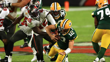 TAMPA, FLORIDA - OCTOBER 18: Devin White #45 of the Tampa Bay Buccaneers sacks Aaron Rodgers #12 of the Green Bay Packers during the fourth quarter at Raymond James Stadium on October 18, 2020 in Tampa, Florida. (Photo by Mike Ehrmann/Getty Images)
