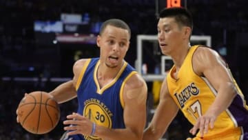 Oct 9, 2014; Los Angeles, CA, USA; Golden State Warriors guard Stephen Curry (30) drives against Los Angeles Lakers guard Jeremy Lin (17) during the first half at Staples Center. Mandatory Credit: Richard Mackson-USA TODAY Sports