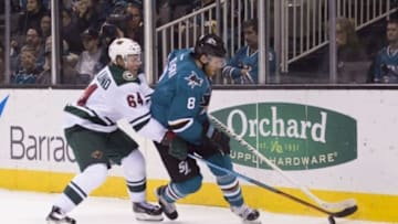 December 12, 2015; San Jose, CA, USA; San Jose Sharks center Joe Pavelski (8) controls the puck against Minnesota Wild center Mikael Granlund (64) during the second period at SAP Center at San Jose. Mandatory Credit: Kyle Terada-USA TODAY Sports