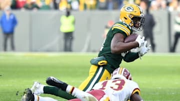 GREEN BAY, WISCONSIN - DECEMBER 08: Strong safety Adrian Amos #31 of the Green Bay Packers intercepts a pass intended for wide receiver Kelvin Harmon #13 of the Washington Redskins during the game at Lambeau Field on December 08, 2019 in Green Bay, Wisconsin. (Photo by Stacy Revere/Getty Images)
