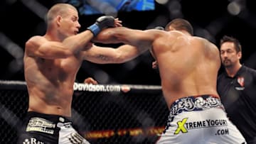 LAS VEGAS - JULY 11: UFC Middleweights Michael Bisping (L) battles Dan Henderson (R) during their Middleweight bout at UFC 100 the Mandalay Bay Hotel and Casino on July 11, 2009 in Las Vegas, Nevada. (Photo by Jon Kopaloff/Getty Images)