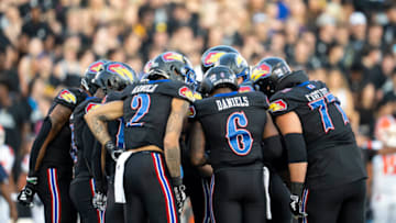 Sep 8, 2023; Lawrence, Kansas, USA; The Kansas Jayhawks offense huddles during the first half against the Illinois Fighting Illini at David Booth Kansas Memorial Stadium. Mandatory Credit: Jay Biggerstaff-USA TODAY Sports