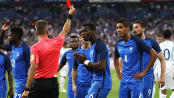 PARIS, FRANCE - JUNE 13: Paul Pogba of France (6) reacts as Raphael Varane of France (4) is shown a red card and is sent off by referee Davide Massa during the International Friendly match between France and England at Stade de France on June 13, 2017 in Paris, France. (Photo by Julian Finney/Getty Images)