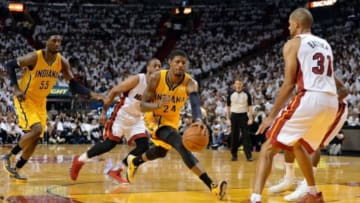 May 30, 2014; Miami, FL, USA; Indiana Pacers forward Paul George (24) controls the ball between Miami Heat forward Shane Battier (31) and guard Dwyane Wade (rear) during the second half in game six of the Eastern Conference Finals of the 2014 NBA Playoffs at American Airlines Arena. Mandatory Credit: Steve Mitchell-USA TODAY Sports