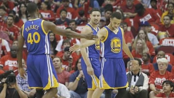 Apr 24, 2016; Houston, TX, USA; Golden State Warriors forward Harrison Barnes (40) congratulates guard Stephen Curry (30) while playing against the Houston Rockets in the first half in game four of the first round of the NBA Playoffs at Toyota Center. Golden State Warriors won 121 to 94. Mandatory Credit: Thomas B. Shea-USA TODAY Sports