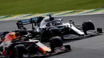 SAO PAULO, BRAZIL - NOVEMBER 17: Max Verstappen of the Netherlands driving the (33) Aston Martin Red Bull Racing RB15 overtakes Lewis Hamilton of Great Britain driving the (44) Mercedes AMG Petronas F1 Team Mercedes W10 on track during the F1 Grand Prix of Brazil at Autodromo Jose Carlos Pace on November 17, 2019 in Sao Paulo, Brazil. (Photo by Charles Coates/Getty Images)