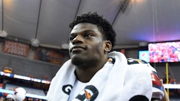 Sep 9, 2016; Syracuse, NY, USA; Louisville Cardinals quarterback Lamar Jackson (8) walks off the field following the game against the Syracuse Orange at the Carrier Dome. Louisville defeated Syracuse 62-28. Mandatory Credit: Rich Barnes-USA TODAY Sports