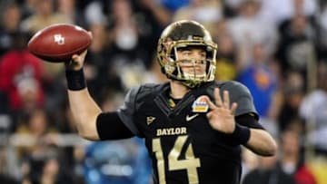 Jan 1, 2014; Glendale, AZ, USA; Baylor Bears quarterback Bryce Petty (14) throws during the second half against the UCF Knights in the Fiesta Bowl at University of Phoenix Stadium. Mandatory Credit: Matt Kartozian-USA TODAY Sports