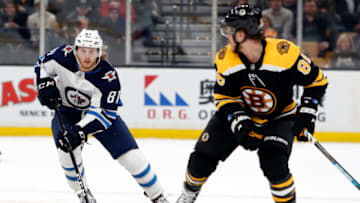 Jan 29, 2019; Boston, MA, USA; Winnipeg Jets left wing Kyle Connor (81) skates with the puck as Boston Bruins right wing David Pastrnak (88) defends during the third period at TD Garden. Mandatory Credit: Winslow Townson-USA TODAY Sports