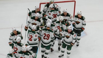 ST. LOUIS, MO - NOVEMBER 11: Members of the Minnesota Wild congratulate Devan Dubnyk #40 of the Minnesota Wild after beating the St. Louis Blues 3-2 at Enterprise Center on November 11, 2018 in St. Louis, Missouri. (Photo by Joe Puetz/NHLI via Getty Images)
