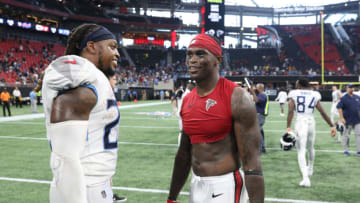 Sep 29, 2019; Atlanta, GA, USA; Tennessee Titans running back Derrick Henry (22) talks with Atlanta Falcons wide receiver Julio Jones (11) after their game at Mercedes-Benz Stadium. Mandatory Credit: Jason Getz-USA TODAY Sports