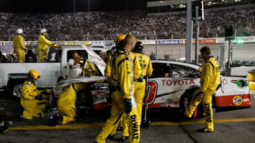 RICHMOND, VA - SEPTEMBER 09: Matt Kenseth, driver of the #20 Hurricane Harvey Relief Toyota, has his car worked on after a crash during the Monster Energy NASCAR Cup Series Federated Auto Parts 400 at Richmond Raceway on September 9, 2017 in Richmond, Virginia. (Photo by Brian Lawdermilk/Getty Images)