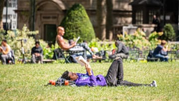 NEW YORK, NEW YORK - SEPTEMBER 22: A person reads a book in Bryant Park as the city continues Phase 4 of re-opening following restrictions imposed to slow the spread of coronavirus on September 22, 2020 in New York City. The fourth phase allows outdoor arts and entertainment, sporting events without fans and media production. (Photo by Noam Galai/Getty Images)