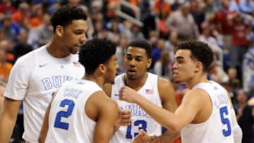 Mar 12, 2015; Greensboro, NC, USA; Duke Blue Devils center Jahlil Okafor (15) guard Quinn Cook (2) guard Matt Jones (13) and guard Tyus Jones (5) huddle during game against the North Carolina State Wolfpack in the first half during the quarterfinals of the ACC Tournament at Greensboro Coliseum. Mandatory Credit: Evan Pike-USA TODAY Sports