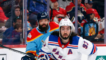 SUNRISE, FL - JANUARY 1: Radko Gudas #7 of the Florida Panthers pursues Mika Zibanejad #93 of the New York Rangers as he chases a loose puck during second period action at the FLA Live Arena on January 1, 2023 in Sunrise, Florida. (Photo by Joel Auerbach/Getty Images)