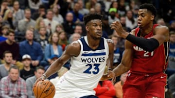 MINNEAPOLIS, MN - NOVEMBER 24: Jimmy Butler #23 of the Minnesota Timberwolves drives to the basket against Hassan Whiteside #21 of the Miami Heat during the game on November 24, 2017 at the Target Center in Minneapolis, Minnesota. NOTE TO USER: User expressly acknowledges and agrees that, by downloading and or using this Photograph, user is consenting to the terms and conditions of the Getty Images License Agreement. (Photo by Hannah Foslien/Getty Images)