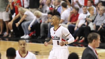 May 7, 2016; Portland, OR, USA; Portland Trail Blazers guard Damian Lillard (0) celebrates in the fourth quarter against the Golden State Warriors in game three of the second round of the NBA Playoffs at Moda Center at the Rose Quarter. Mandatory Credit: Jaime Valdez-USA TODAY Sports