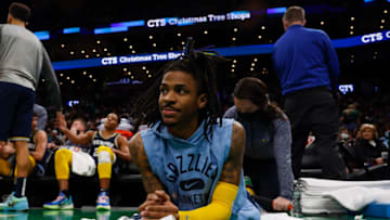 Mar 3, 2022; Boston, Massachusetts, USA; Memphis Grizzlies guard Ja Morant (12) has his leg stretched out during the second half against the Boston Celtics at TD Garden. (Winslow Townson-USA TODAY Sports)